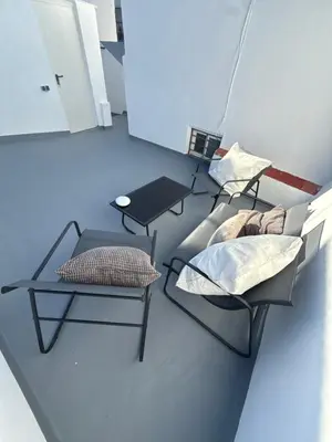 two chairs and a table in a room at Apartamento TATA, Arcos de la Frontera in Arcos de la Frontera