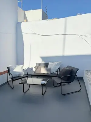a living room with two chairs and a couch at Apartamento TATA, Arcos de la Frontera in Arcos de la Frontera