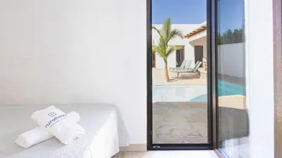 a hotel room with a table with a towel on it at Galdana Chiclana de la Frontera by Ruralidays in Chiclana de la Frontera
