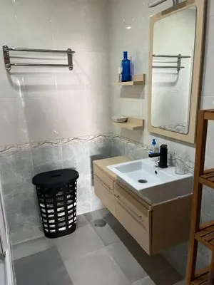 a bathroom with a sink and a mirror at Dúplex a 700 m de la Playa de La Barrosa in Novo Sancti Petri
