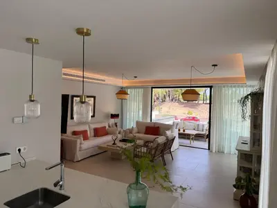 a living room with two couches and a table at Apartamento RG Acciona Vistahermosa in El Puerto de Santa María