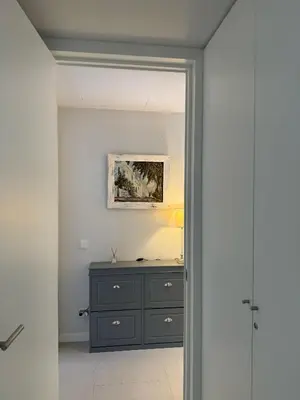 a room with a dresser and a painting on the wall at Apartamento RG Acciona Vistahermosa in El Puerto de Santa María
