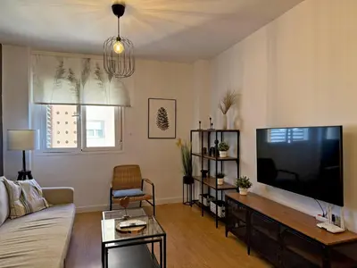 a living room with a large flat screen tv at Apartamento Renfurbis - Ole Solutions in Jerez de la Frontera