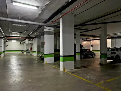 an empty parking garage with cars parked in it at Apartamento Renfurbis - Ole Solutions in Jerez de la Frontera