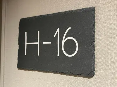 a black sign with the number on a wall at Mape Loft Rural Aljibe in Algar