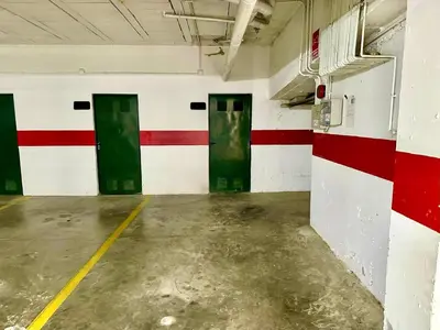 a room with green doors and red and white walls at Apartamento La Barrosa - Aldea del Coto in Novo Sancti Petri
