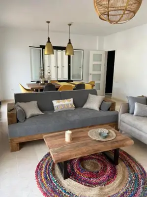 a living room with a couch and a coffee table at Martiniano in Conil de la Frontera