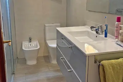 a bathroom with a sink and a toilet at Playa, Sol y Relax in Cádiz