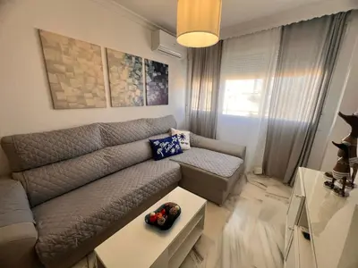 a living room with a couch and a table at Puertas del Mar 1 in Puerto Real