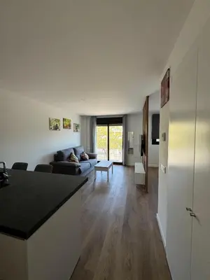 a living room with a couch and a table at Roomy Estudio in Jerez de la Frontera