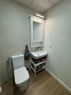 a bathroom with a white toilet and a sink at Roomy Estudio in Jerez de la Frontera