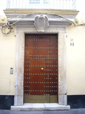 a large wooden door in the front of a building at Tacita Investments,SL in Cádiz