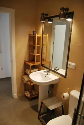 a bathroom with a sink and a mirror at Tacita Investments,SL in Cádiz