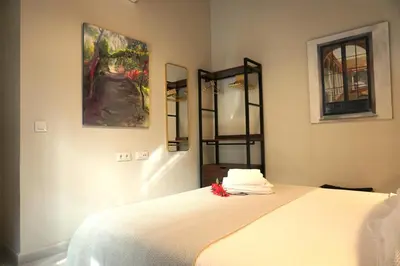 an open door in a room with a kitchen at San Miguel Suite Gallery in Jerez de la Frontera