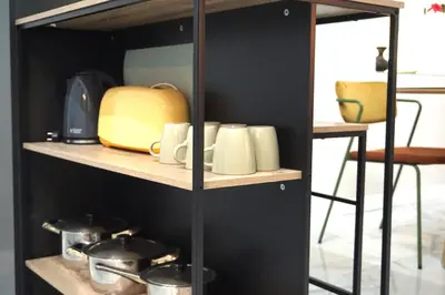 a kitchen counter with an orange juicer on top of it at San Miguel Suite Gallery in Jerez de la Frontera