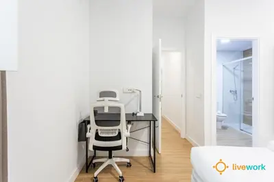 an office with a desk and a chair in a room at Cádiz Living by LiveWork in Cádiz