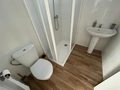 a bathroom with a toilet and a shower and a sink at casa comoda sanluca in Monte Olivete