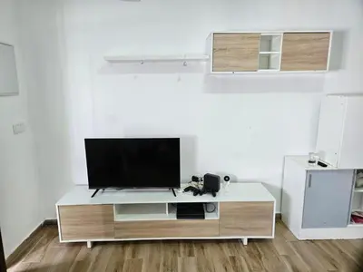 a living room with a flat screen tv on a table at casa comoda sanluca in Monte Olivete
