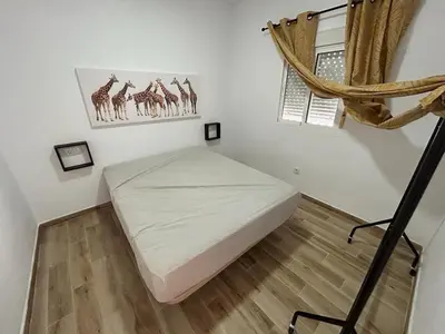 a small bedroom with a bed and a window at casa comoda sanluca in Monte Olivete