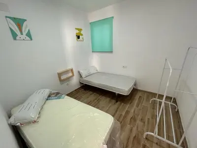 a hospital room with two beds and a window at casa comoda sanluca in Monte Olivete