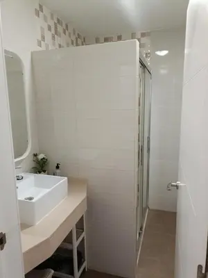 a bathroom with a sink and a shower at Buleria in Jerez de la Frontera