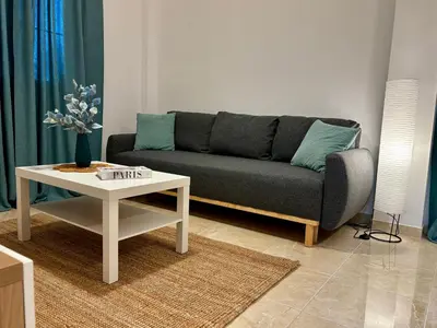 a living room with a couch and a table at Apartamento MAREMIA in San Fernando