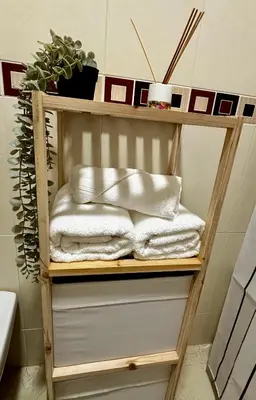 a towel shelf in a bathroom with towels at Apartamento MAREMIA in San Fernando