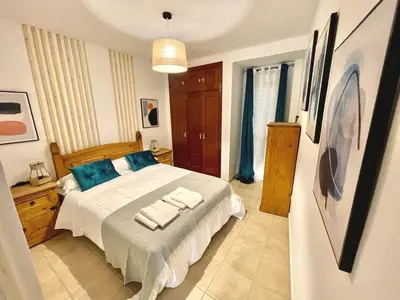 a bedroom with a bed with two towels on it at Loft 41 en Algar by Villamya in Algar