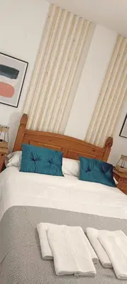 a bedroom with a bed with two towels on it at Loft 41 en Algar by Villamya in Algar