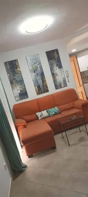 a living room with a couch and a table at Loft 41 en Algar by Villamya in Algar