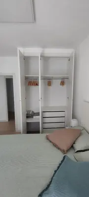 a bedroom with a bed with white shelving at Cruces by LiveWork in El Puerto de Santa María