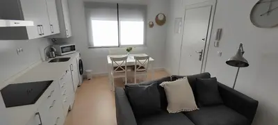a living room with a couch and a table at Cruces by LiveWork in El Puerto de Santa María