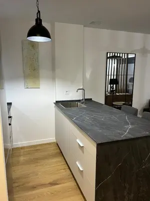 a kitchen with a sink and a counter top at Ático Roomy in Jerez de la Frontera