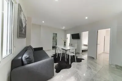 a living room with a couch and a table at Apartamento Luz de Cádiz in Cádiz