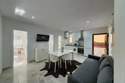 a living room with a couch and a table at Apartamento Luz de Cádiz in Cádiz