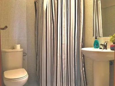 a bathroom with a toilet and a sink at Renfurbis apartment in Jerez de la Frontera
