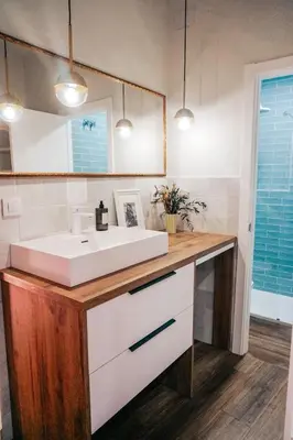 a bathroom with a white sink and a mirror at Apartamento en pleno centro de Jerez con patio privado in Jerez de la Frontera