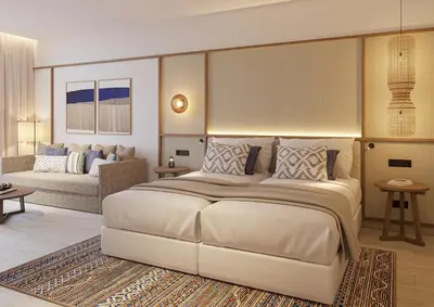 a bedroom with a large bed and a couch at Gran Hotel Luna de Cádiz in Cádiz