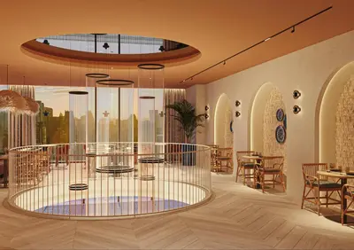 a lobby with a large glass table and chairs at Gran Hotel Luna de Cádiz in Cádiz