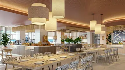 a dining room with tables and chairs and chandeliers at Gran Hotel Luna de Cádiz in Cádiz