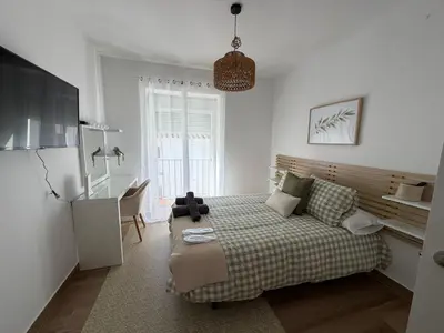 a white washing machine in a room at El Olivar de Sol in Jerez de la Frontera