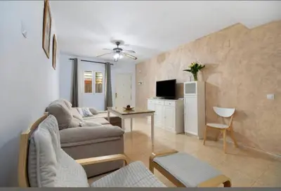 a living room with a couch and a table at Bajamar in Sanlúcar de Barrameda