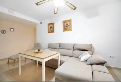 a living room with a couch and a table at Bajamar in Sanlúcar de Barrameda