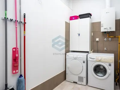 a laundry room with a washing machine and a washer at Villa Sol Sal free parking by Staycare in Rota