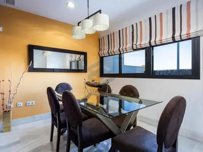 a dining room with a glass table and chairs at Villa Sol Sal free parking by Staycare in Rota