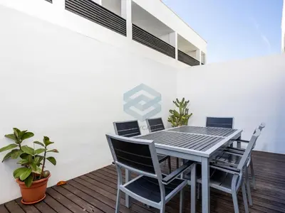 a dining room with a table and chairs at Villa Sol Sal free parking by Staycare in Rota