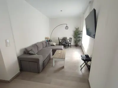 a living room with a couch and a table at Moderno apartamento en el centro de Jerez in Jerez de la Frontera