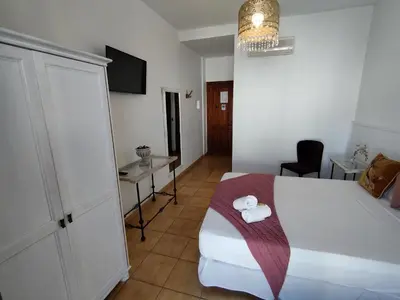 a hotel room with a bed with towels on it at Hotel Pozo Rey by Youroom in Chipiona