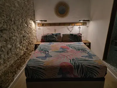 a bedroom with a bed with butterflies on it at Chiclanero Loft in Chiclana de la Frontera