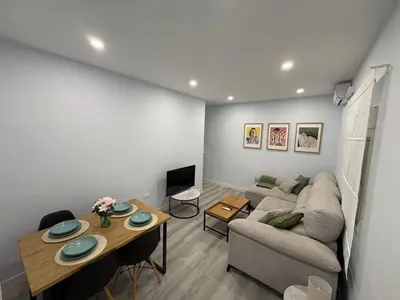 a living room with a couch and a table at Apartamento Centro de Rota La Costilla in Rota